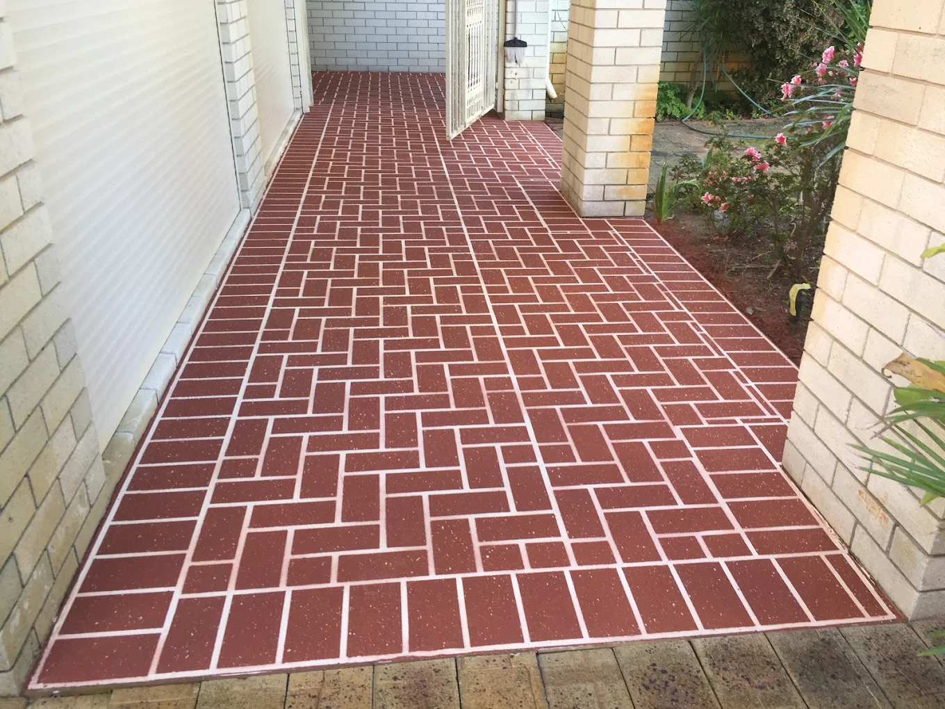 Sealed decorative concrete surface illustrating sealer wear